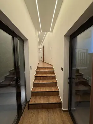 a staircase in a building with wooden floors at City Center Jacuzzi Lux 2master BD apartment in Athens