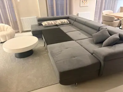 a living room with a couch and a table at Pireaus Center Apartment in Piraeus