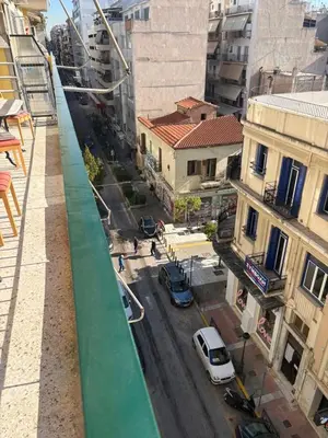 a view of a city street with cars and buildings at Pireaus Center Apartment in Piraeus