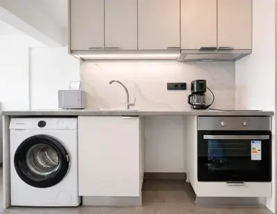 a kitchen with a washing machine and a sink at Athens View Studio Near Lycabettus Hill by MPS in Athens