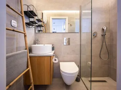 a bathroom with a toilet and a sink and a shower at Ioli Seafront Hideaway by Porto Rafti Marina in Porto Rafti