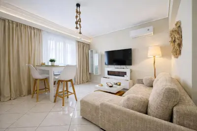 a living room with a couch and a table at Like a Royal - Luxury Boho Apartment in Glyfada in Athens