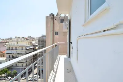 a balcony with a view of a city at A cute and comfortable two bedroom apartment in Piraeus
