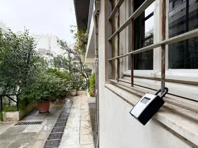 a briefcase hanging on the side of a window at Charming and cozy studio apartment in Athens