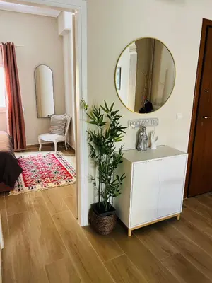 a bedroom with a white dresser and a mirror at BoraBora Flat in Piraeus