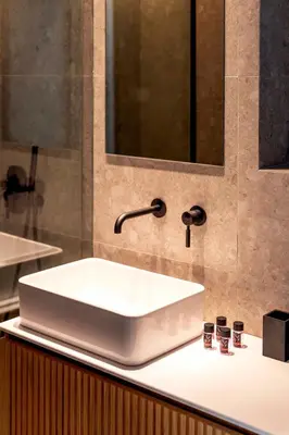 a white sink on a counter in a bathroom at Boutique17 Luxury Apartment Ground Floοr in Athens