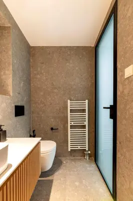 a bathroom with a toilet and a sink at Boutique17 Luxury Apartment Ground Floοr in Athens