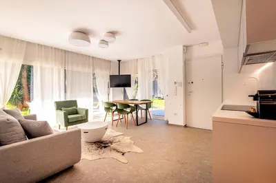 a living room with a couch and a table at Boutique17 Luxury Apartment Ground Floοr in Athens