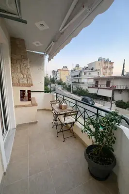 a balcony with a table and chairs and a view at Bright & Spacious 80sqm Apartment Glyfada,Balcony in Athens