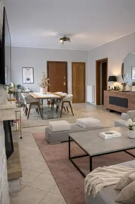 a living room with a table and a dining room at Bright & Spacious 80sqm Apartment Glyfada,Balcony in Athens