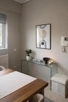a room with a bed and a table and a chair at Bright & Spacious 80sqm Apartment Glyfada,Balcony in Athens