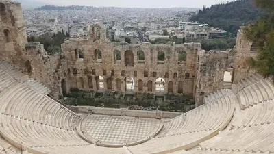 an empty amphitheater with a city in the background at Athens Backpackers in Athens