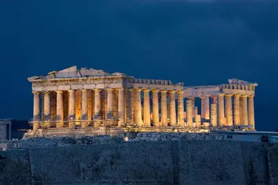 a building lit up at night at Athens Backpackers in Athens