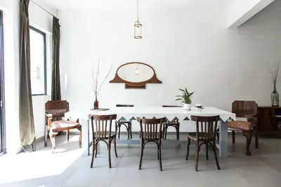 a dining room with a white table and chairs at Concierge Monastiraki in Athens