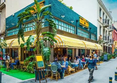 a group of people sitting outside of a restaurant at Concierge Monastiraki in Athens