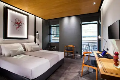 a bedroom with a bed and a desk with a computer at MET34 Athens in Athens