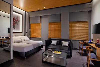 a living room with a bed and a couch at MET34 Athens in Athens