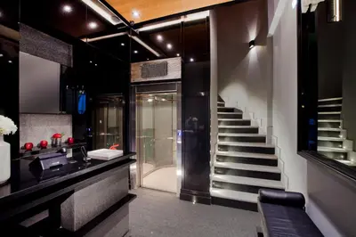 a bathroom with a staircase and a sink and a stair case at MET34 Athens in Athens