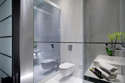 a white bathroom with a toilet and a sink at MET34 Athens in Athens
