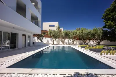 a swimming pool in the backyard of a house at Infinity White Complex by GK Properties in Porto Rafti