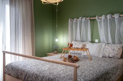 a bedroom with a bed with a teddy bear on it at Apartment at the foothills of Acropolis in Athens