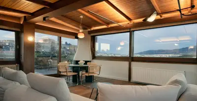 a living room with white furniture and large windows at KARYATIS LUXURY MAISONETTE by K&K in Athens