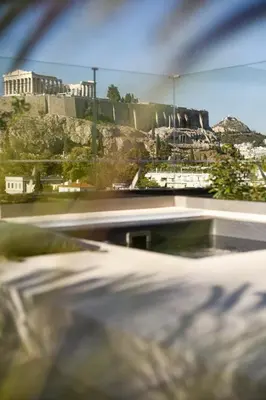a view of the acropolis from a skate park at KARYATIS LUXURY MAISONETTE by K&K in Athens