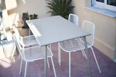 a white table and chairs in a room at Kolonaki Boutique Apartments by Olala Homes in Athens