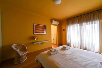 a bedroom with a bed and a window with towels on it at Kolonaki Boutique Apartments by Olala Homes in Athens
