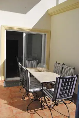 a table and chairs with a bowl on top of it at Thimari Sports & Spa with private pool and jacuzzi in Sounio