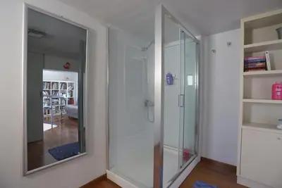a glass shower in a room with a mirror at Thimari Sports & Spa with private pool and jacuzzi in Sounio