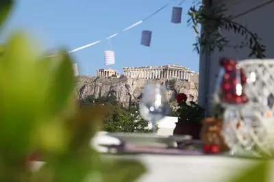 a view of the acropolis of athens from a table with a view at Live in Athens, THISEIO Residency, Our first love #01 in Athens