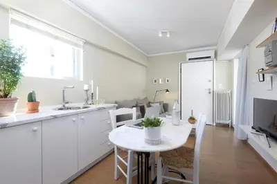 a kitchen and dining room with a table and chairs at Live in Athens, THISEIO Residency, Our first love #01 in Athens