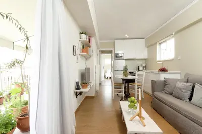 a living room with a couch and a table at Live in Athens, THISEIO Residency, Our first love #01 in Athens