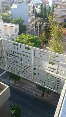 arial view of a white building in a city at Athina Art Apartments in Athens