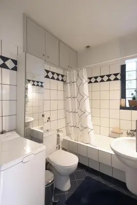 a bathroom with a toilet and a tub and a sink at Dimitris Home in Athens