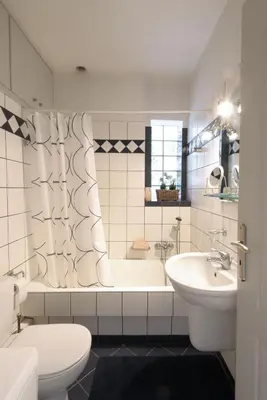 a bathroom with a tub and a toilet and a sink at Dimitris Home in Athens