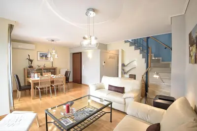 a living room with a couch and a table at Dimitris Home in Athens