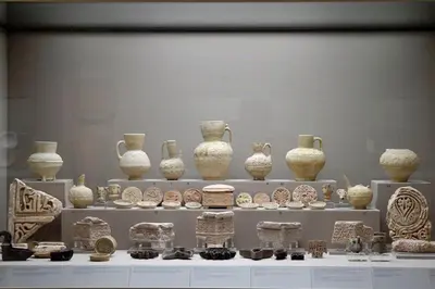 a display of vases and other pottery in a museum at Acropolis Tony's Penthouse in Athens
