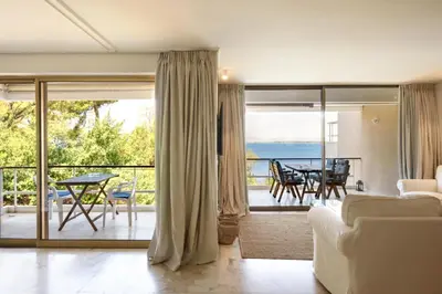 a living room with a view of the ocean at Kavouri Flat in Athens