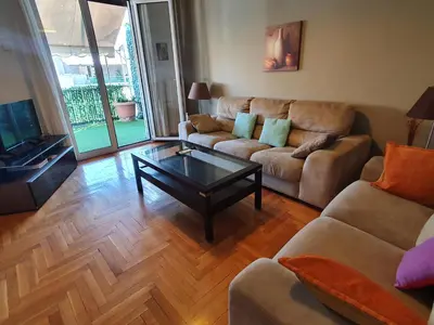 a living room with a couch and a coffee table at Pedion Areos Park 4 Center 4 in Athens