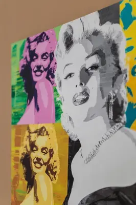 a painting of a woman and two portraits at Pedion Areos Park 4 Center 4 in Athens