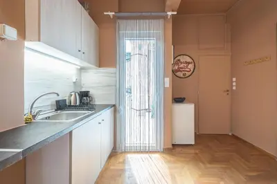 a kitchen with a sink and a counter top at Studio Under Acropolis Rock in Athens