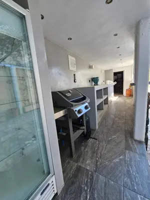 a kitchen with a counter and a stove in it at Villa Emily in Lagonissi