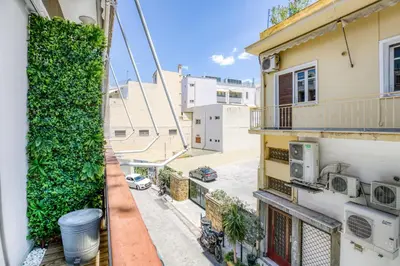 an apartment balcony with a view of a street at Studio in The Heart of Acropolis in Athens