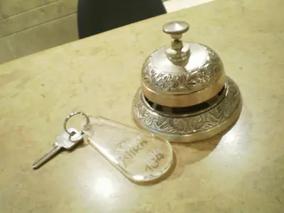 a small silver key on top of a table at Hotel Niki Piraeus in Piraeus