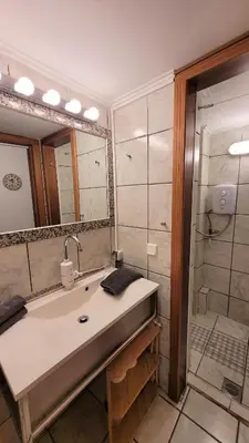 a bathroom with a sink and a shower at Driopon Apartment in Athens