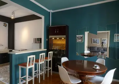 a kitchen and dining room with a table and chairs at The Belgian Connection in Koukaki in Athens