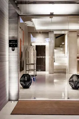 a display case in a store with two black objects at Somewhere Vouliagmeni in Athens