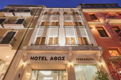 a hotel aces sign on the side of a building at Athos Hotel in Athens
